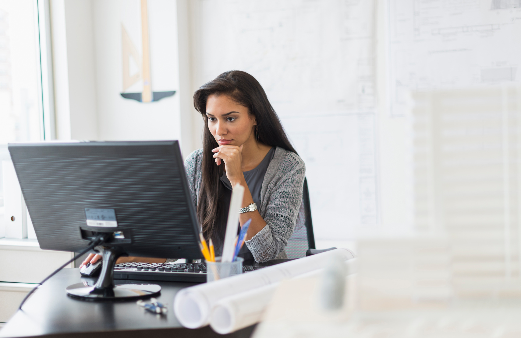 Hispanic businesswoman working in office Hispanic businesswoman working in office