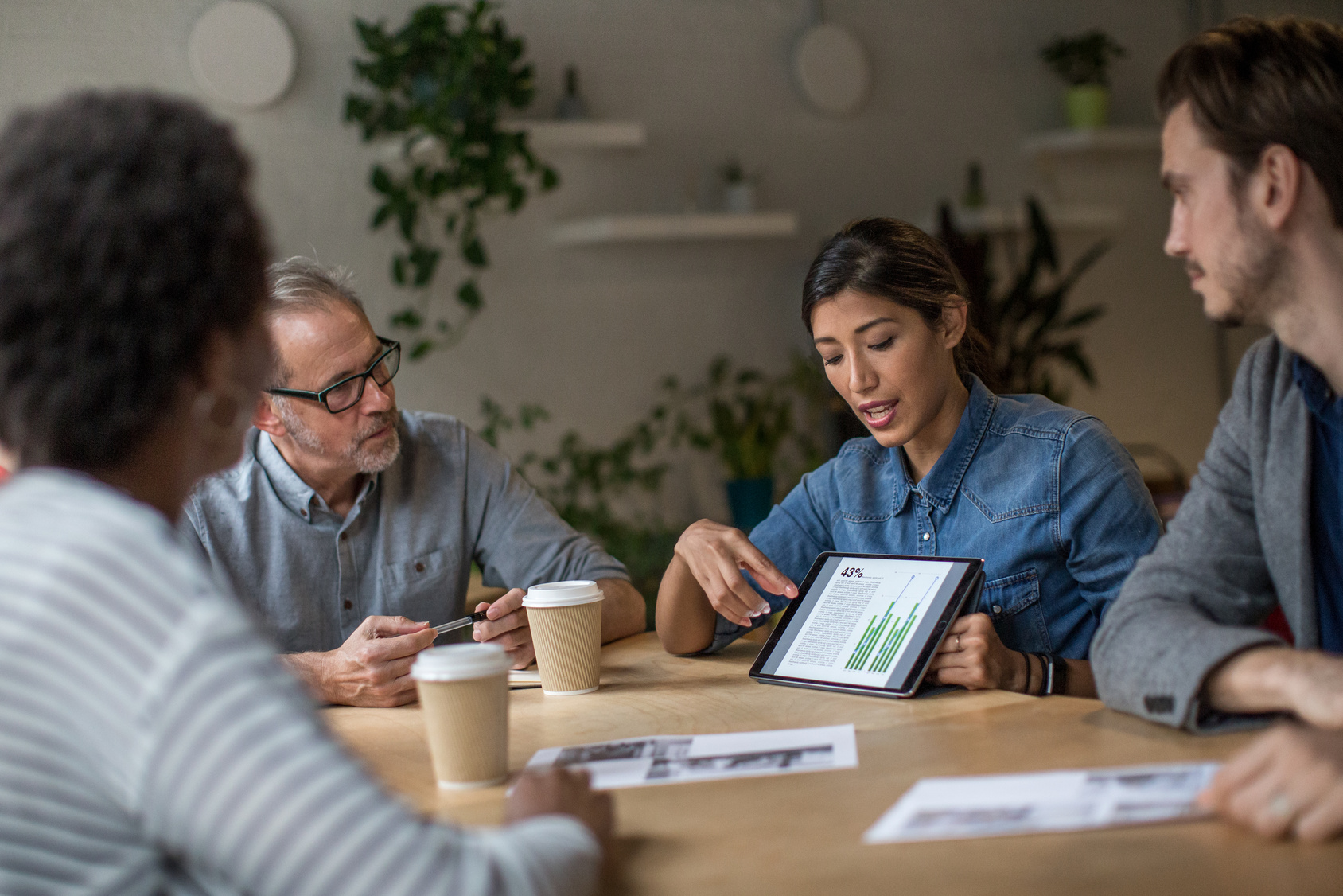 Businesswoman giving a presentation in a business meeting Businesswoman giving a presentation in a business meeting